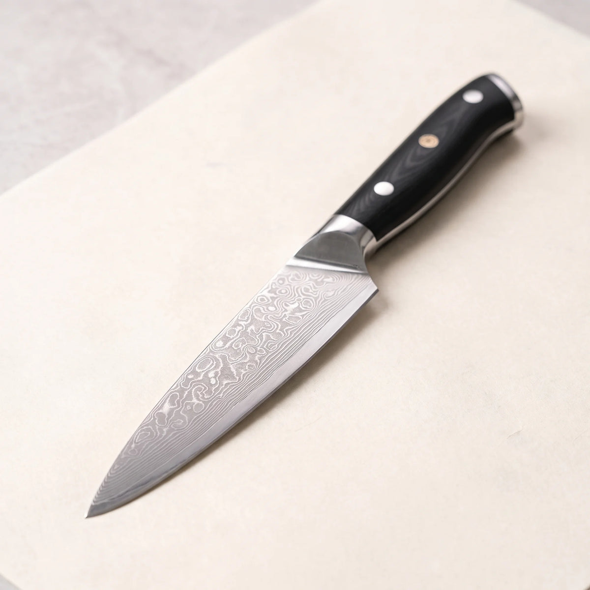 Damascus Utility Knife 4.8" – Hochodo, three-quarter view